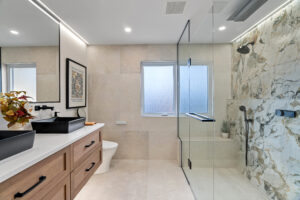 Modern bathroom renovation with custom cabinetry, tile and coordinated finishes