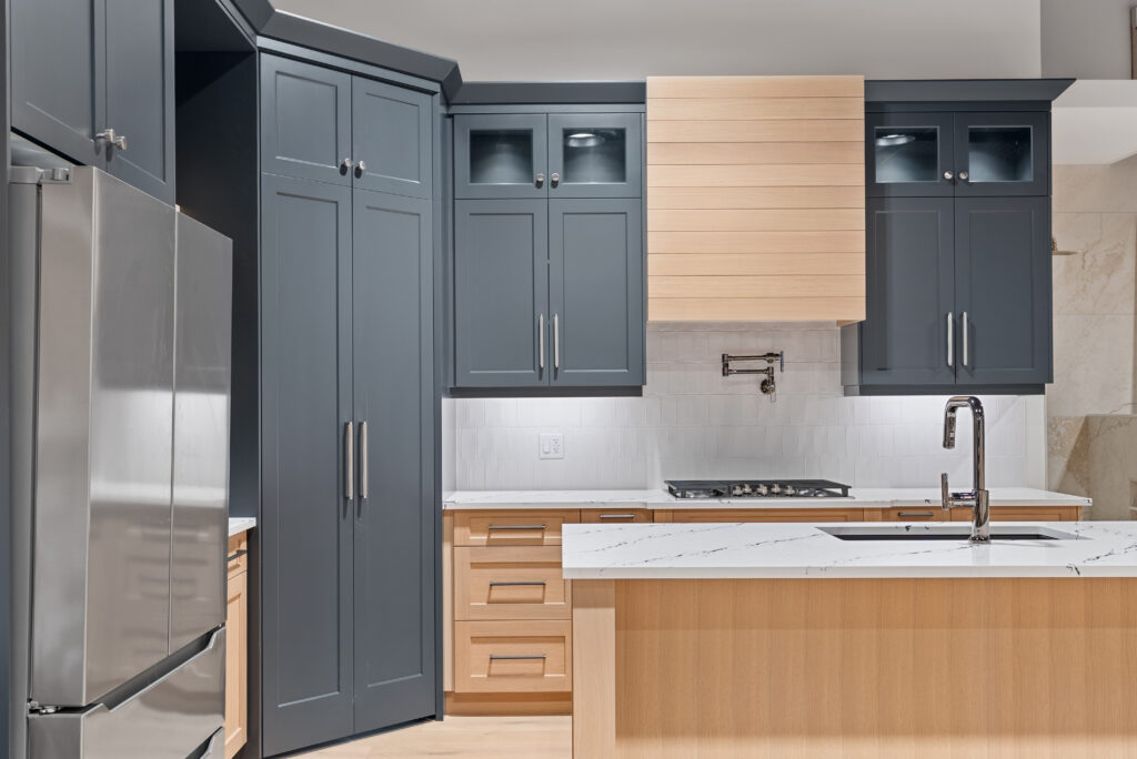Cottage kitchen with custom cabinetry and large island