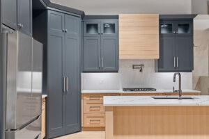 Cottage kitchen with custom cabinetry and large island